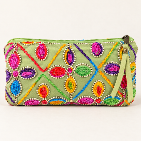 Atenti Confetti Garden Tall Tool Pouch with bright multicolor embroidered floral shapes on green fabric.
