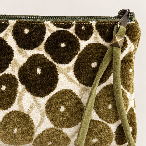 Close-up of olive and brown spotted fabric, zipper and long pull on Atenti Olive Cheetah Tall Tool Pouch.