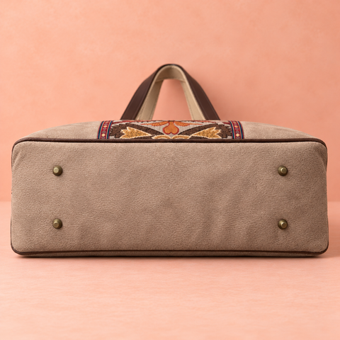Tapestry Overnighter taupe base with four brass feet