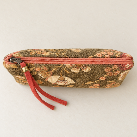 Top view of Atenti Woodland Bloom Tall Tool Pouch, showing the coral zipper across olive floral fabric.
